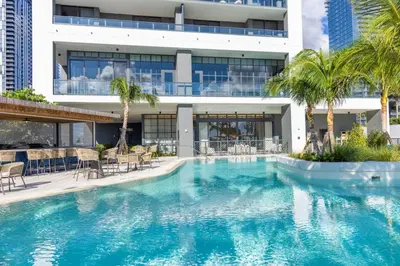 a large swimming pool in front of a building at 3312 Modern Apt in front of Kaseya Center with Pool and Gym in Miami