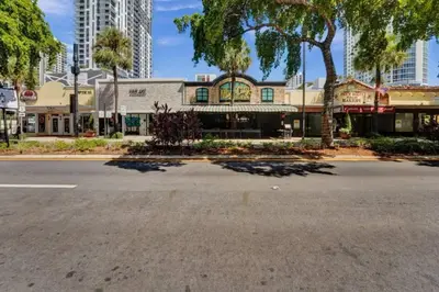 an empty street in a city with tall buildings at Eden Collection Junior Suite Steps to Beach in Fort Lauderdale