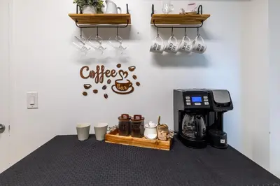 a coffee station with a coffee maker and a espresso machine at Beachfront Winter Escape, Balcony with Ocean View, Amenities in Hollywood