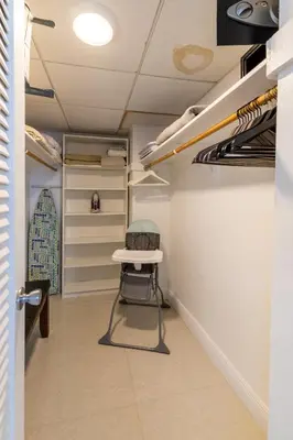 a walk in closet with a stool in a room at Beachfront Winter Escape, Balcony with Ocean View, Amenities in Hollywood