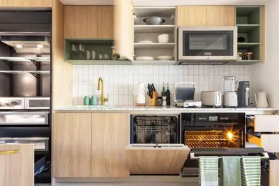 a kitchen with a stove and a microwave at 4513 a 1-Bedroom Apt with Pool and Gym next to Kaseya Center in Miami