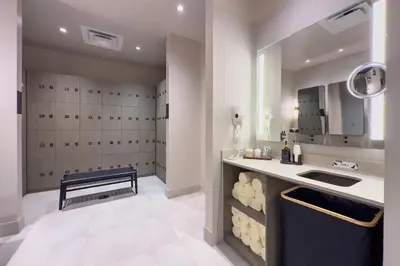 a bathroom with a sink and a bench in a room at 4513 a 1-Bedroom Apt with Pool and Gym next to Kaseya Center in Miami