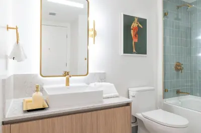 a bathroom with a sink and a toilet and a mirror at 4513 a 1-Bedroom Apt with Pool and Gym next to Kaseya Center in Miami