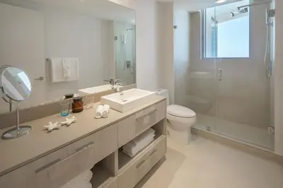a bathroom with a sink and a toilet and a shower at Lyfe Resort & Residences By OceanMiami in Hollywood