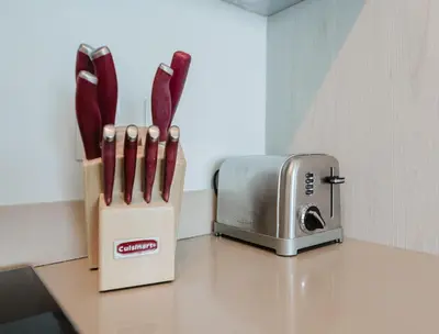 two block of knives sitting next to a toaster at Lyfe Resort & Residences By OceanMiami in Hollywood