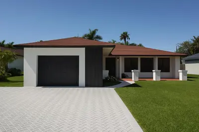 a house with a garage and a green lawn at Santamaria Fort Lauderdale Airport in Fort Lauderdale