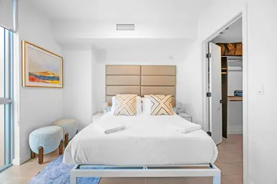a bedroom with a large white bed in a room at Modern Comfort by the Beautiful Bay in Miami