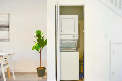 a refrigerator and a plant in a room at Family-Friendly Townhouse Getaway Near Top Attractions in Golden Glades