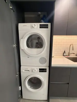 a washing machine and a washer in a kitchen at Stunning City Views Studio Gym Pool in Miami
