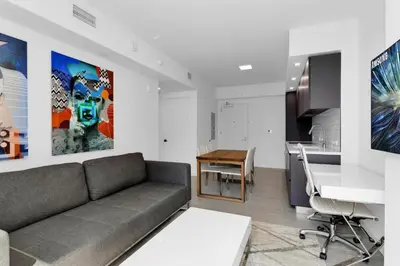 a living room with a couch and a kitchen at Downtown Large Stylish 1 bedroom condo Gym pool in Miami