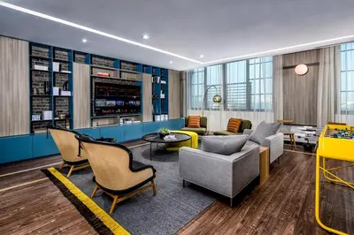 a lobby with chairs and a couch and a table at The Juliet VI Vibe 8701 in Miami