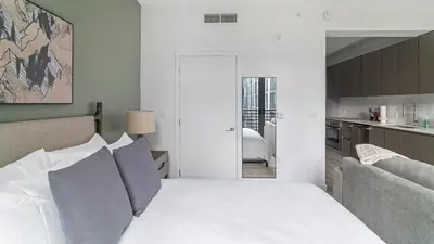 a bedroom with a white bed and a couch at The Juliet X Vibe 8741 in Miami