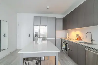 a kitchen with a white counter top and a sink at The Juliet XI Vibe 8744 in Miami