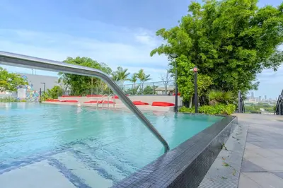 a swimming pool with a metal rail in the water at The Juliet XI Vibe 8744 in Miami