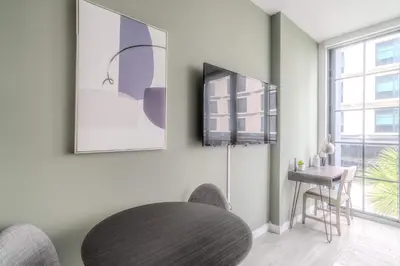 a dining room with a round table and a window at The Juliet XI Vibe 8744 in Miami