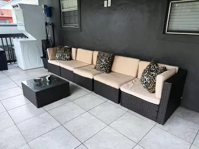 a living room with a couch and a table at Wynwood Bungalows By Renzzi in Miami