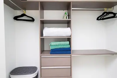a closet with a toilet and towels in it at Luxe Ventures Miami in Miami
