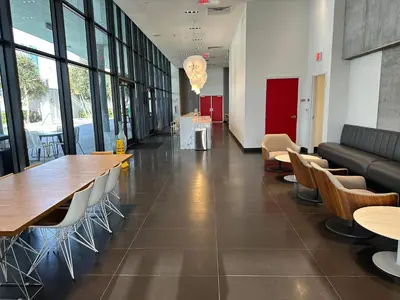 a cafeteria with tables and chairs in a building at Luxury 2BR Skyline Balcony Free Parking by Palermo Home Miami in Miami