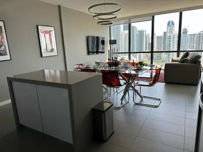 a kitchen and living room with a table and chairs at Luxury 2BR Skyline Balcony Free Parking by Palermo Home Miami in Miami