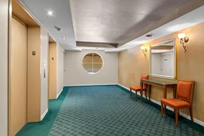 a hallway with chairs and a table and a mirror at Yacht Club Miami Suite 1BR and 1BA with Pool FREE Parking Gym & Jacuzzi in South Island