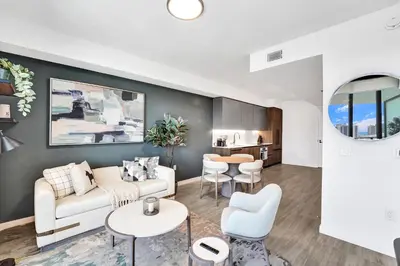 a living room with a couch and a table at 72 Park by Nomada Residences in Miami Beach