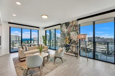 a living room with a view of a city at 72 Park by Nomada Residences in Miami Beach