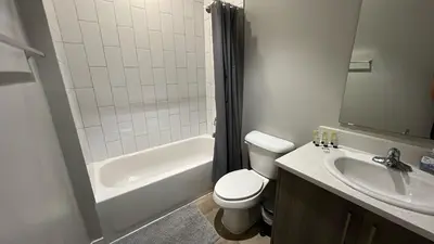 a bathroom with a toilet and a sink and a shower at Family Comfort Near Top Spots-Relaxing Stay for Everyone in Golden Glades