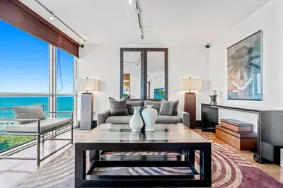 a living room with a couch and a table at The Setai Miami Private Luxury Residences in Miami Beach