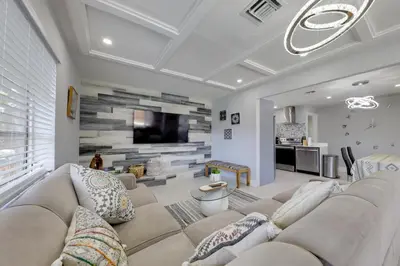 a living room with a couch and a tv at Unique 2 House Rental 3 Mi to Beach and Boardwalk in Hollywood