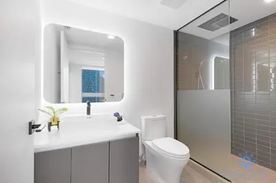 a bathroom with a sink and a toilet and a shower at Beautiful 2BR Apartment with gym and Pool in Miami