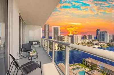an apartment balcony with a view of the city at Stylish -2BR Apartment -Balcony & Pool in Hallandale Beach
