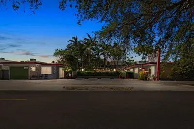 a row of houses with lights on a street at Relaxing 1BR w/ BBQ, Patio & Convenient Access in Hollywood