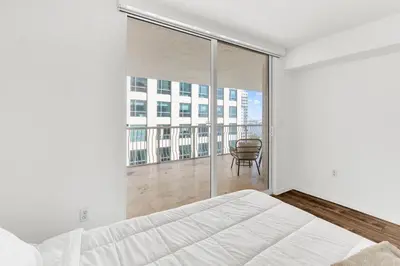 a bedroom with a bed and a large window at Luxury3 Miami Brickell Stay-Bay View in Miami