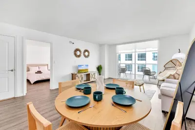 a dining room and living room with a wooden table at Luxury3 Miami Brickell Stay-Bay View in Miami