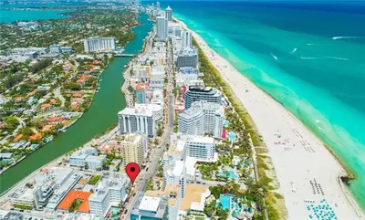 an aerial view of a beach with a red marker at Contemporary chic, next to the beach - 1 Bedroom in Miami Beach