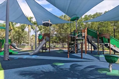 a park with a playground with a slide and slidesktop at South Beach South of Fifth 1 Bedroom Apartment Steps to Beach Sleeps 5 Pet Friendly in Miami Beach