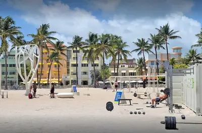 a beach with people playing volley ball on the beach at South Beach South of Fifth 1 Bedroom Apartment Steps to Beach Sleeps 5 Pet Friendly in Miami Beach
