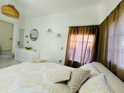 a bedroom with a large bed and a window at Stylish Studio in Heart of Miami in Miami