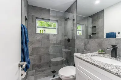 a bathroom with a toilet and a sink at New Apt 2 Bed 2 Bath with Amazing PATIO in Fort Lauderdale