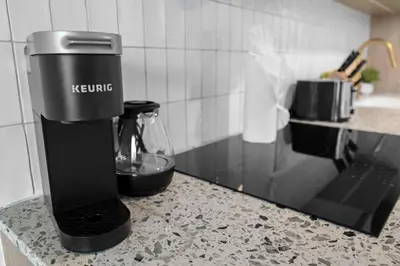 a coffee maker sitting on a counter in a kitchen at Sunlit 1BR Condo In Downtown Miami in Miami