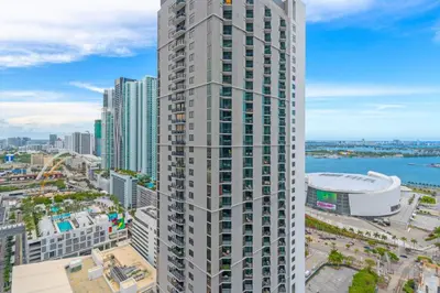 an aerial view of a tall building in a city at Experience Miami Vibes in the Heart of Downtown in Miami