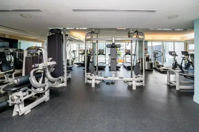 a gym with several tread machines in a room at 23rd Floor W 2BR with Den, Ocean Views, Sleeps 8 in Fort Lauderdale