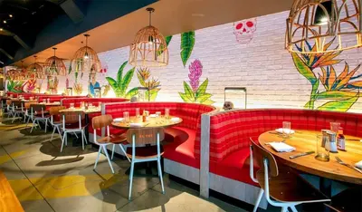 a restaurant with red seats and a wall with plants at 23rd Floor W 2BR with Den, Ocean Views, Sleeps 8 in Fort Lauderdale