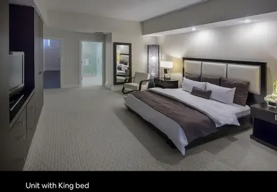 a large bedroom with a large bed and a television at Provident Doral at The Blue in Miami