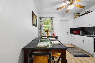 a kitchen with a table and a ceiling fan at Brickell Stay: Near Beach Downtown Pet-Friendly in Miami