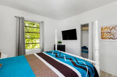 a bedroom with a bed and a window at Brickell Stay: Near Beach Downtown Pet-Friendly in Miami