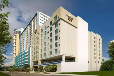 a large white building with a sign on it at Homewood Suites by Hilton Miami Downtown/Brickell in Miami