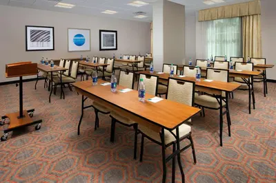 a classroom with tables and chairs in a room at Homewood Suites by Hilton Miami Downtown/Brickell in Miami