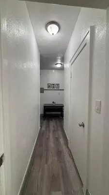 an empty hallway with a door and a wooden floor at Noemi's Studio Suite Steps To Marlins Stadium At Little Havana in Miami