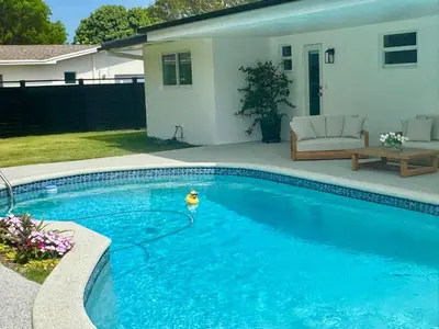a swimming pool with a toy in the middle at Chic-ness Oasis NOW HEATED POOL ! in Cutler Bay
